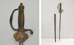 POSSIBLY A PRE-WAR MILITARY COURT SWORD OR DRESS SWORD, POSSIBLY PERSIAN??? THE HILT IS A LION HOLDING A SWORD. PLEASE COME PREVIEW