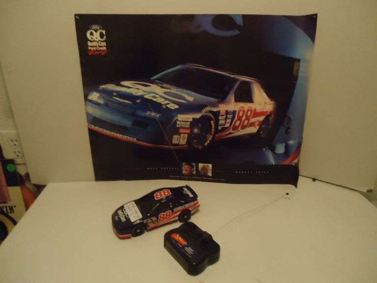 CASH ONLY  Dale Jarrett XRC 27 MHZ remote controlled car, said it needs some soldering, and a Ford Racing picture. (U)