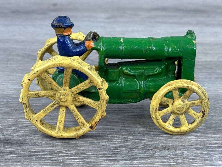 Arcade Cast Iron Tractor W/Cast In Driver, 4 1/2” Long