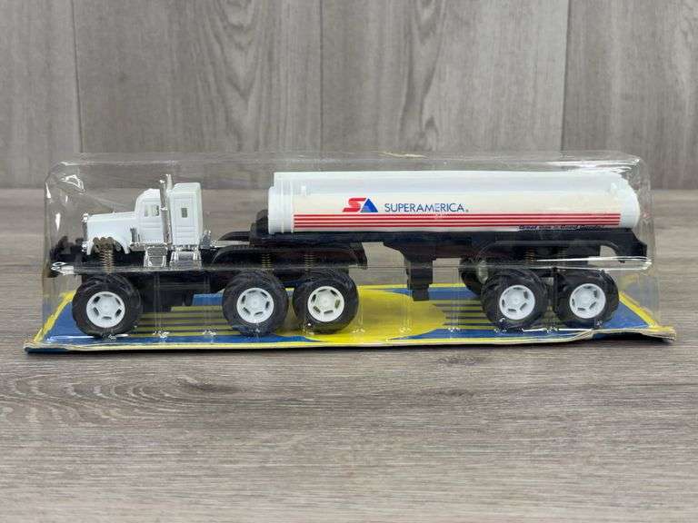 Super America Tractor Tanker, Super Friction Top Trucks, 10 3/4” Long, New Ray Toys, Plastic Not Fully Attached