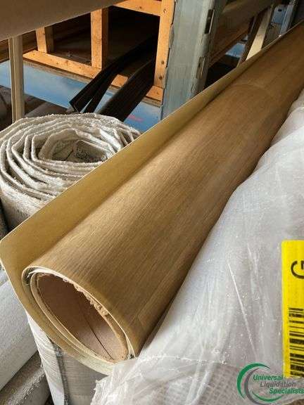 14 rolls of carpet and roll of vinyl