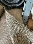 14 rolls of carpet and roll of vinyl