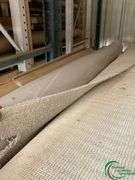 14 rolls of carpet and roll of vinyl