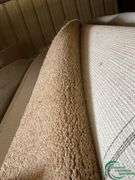 14 rolls of carpet and roll of vinyl