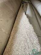 14 rolls of carpet and roll of vinyl