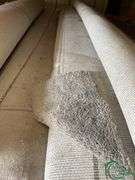 14 rolls of carpet and roll of vinyl