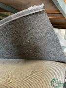 14 rolls of carpet and roll of vinyl