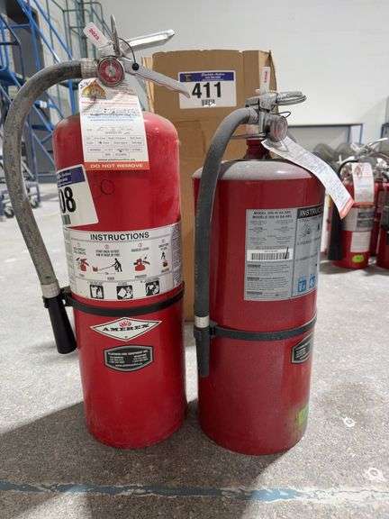 TWO FIRE EXTINGUISHERS