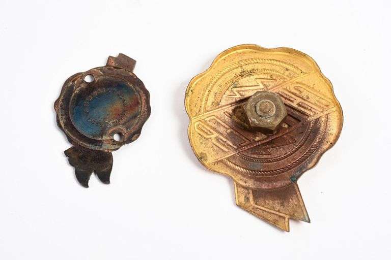 TWO CHRYSLER AUTOMOBILE BADGES