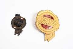 TWO CHRYSLER AUTOMOBILE BADGES