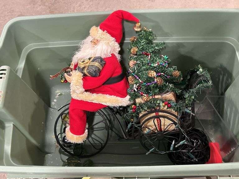 TOTE OF STUFFED ANIMALS & SANTA RIDING A BIKE