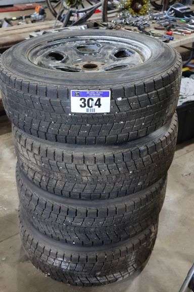 4 DUNLOP 245/60R18 105R TIRES ON RIMS