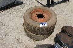 PAIR OF 8 BOLT SKID STEER TIRES & RIMS