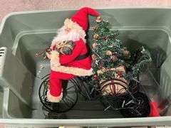 TOTE OF STUFFED ANIMALS & SANTA RIDING A BIKE