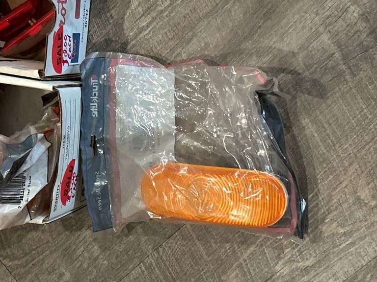 FOUR BOXES OF ASSORTED LIGHTS AND LIGHT CAPS