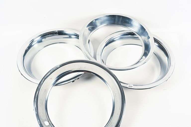 FOUR CHROME PLATED WHEEL TRIM RINGS - Shackelton Auctions Inc.
