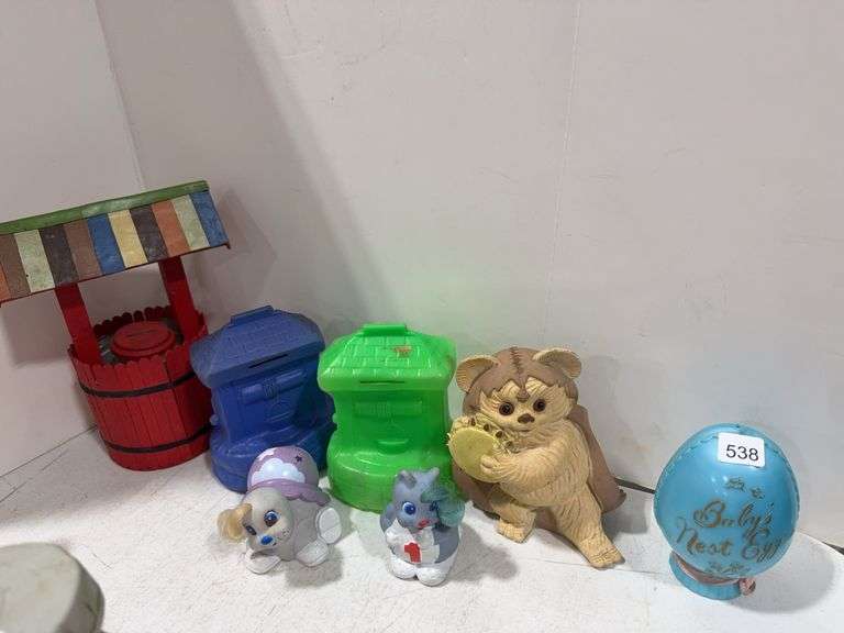 SEVEN ASSORTED COIN BANKS - Shackelton Auctions Inc.