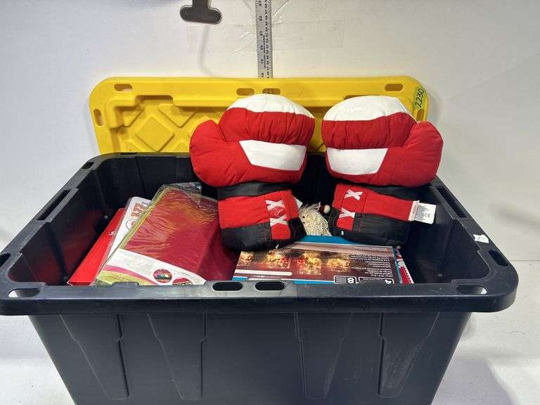 Storage box w/ assorted Christmas decorations, stuffed boxing gloves