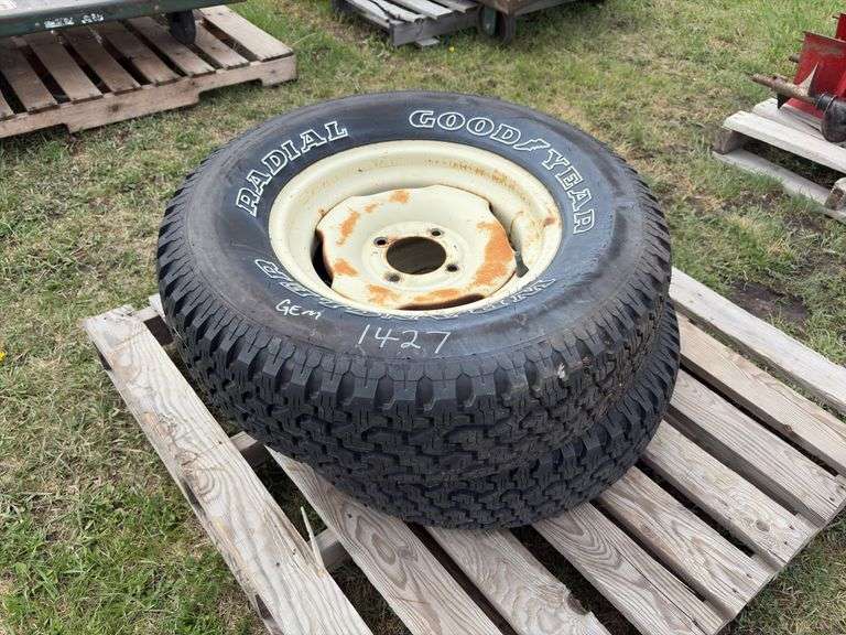 2 Goodyear Wrangler tires on 4 bolt rims, P235/70R15, *Unreserved ...