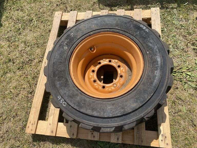 Skid steer wheel w/ tire 12-16.5 10PR, *Unreserved*