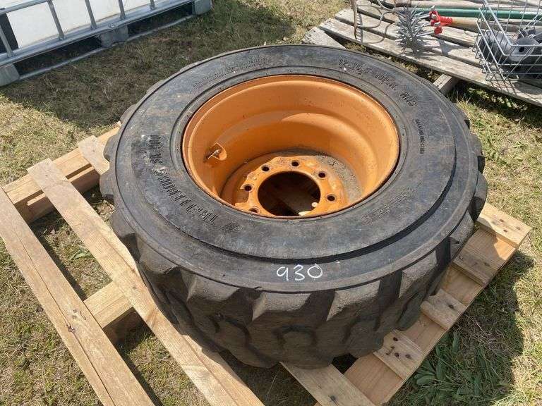 Skid steer wheel w/ tire 12-16.5 10PR, *Unreserved*