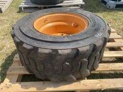 Skid steer wheel w/ tire 12-16.5 10PR, *Unreserved*