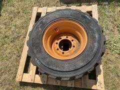 Skid steer wheel w/ tire 12-16.5 10PR, *Unreserved*