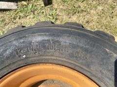 Skid steer wheel w/ tire 12-16.5 10PR, *Unreserved*