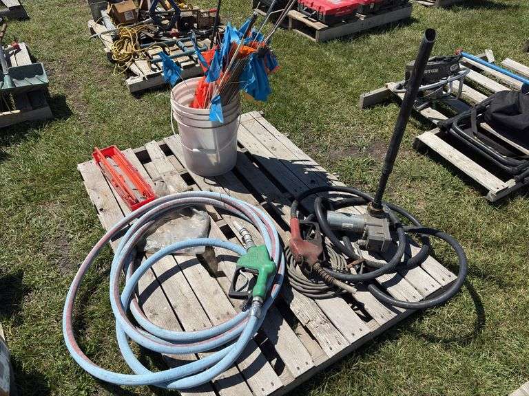 Pallet w/ Fuel pump w/ motor - unknown condition, fuel pump, bucket of market flags, *Unreserved*