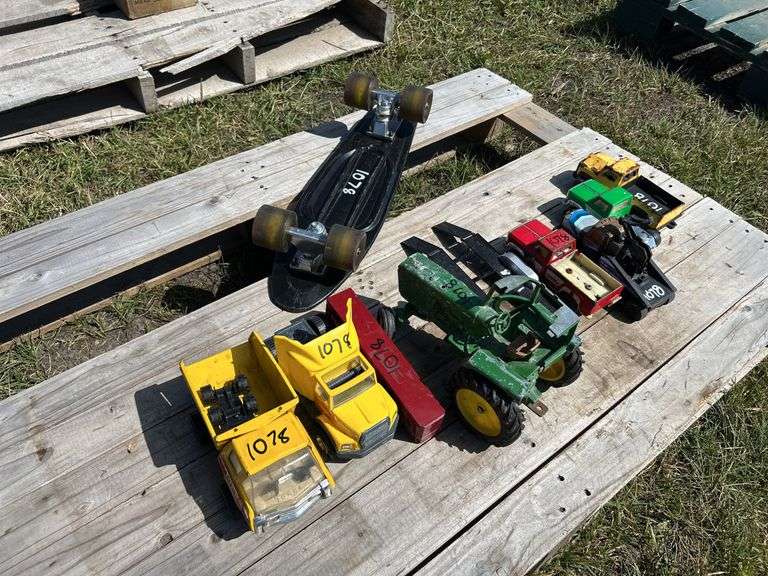Pallet w/ Vintage toy vehicles, metal/plastic Tonka, John Deere (approx 9), Mini skateboard 1'9", *Unreserved*