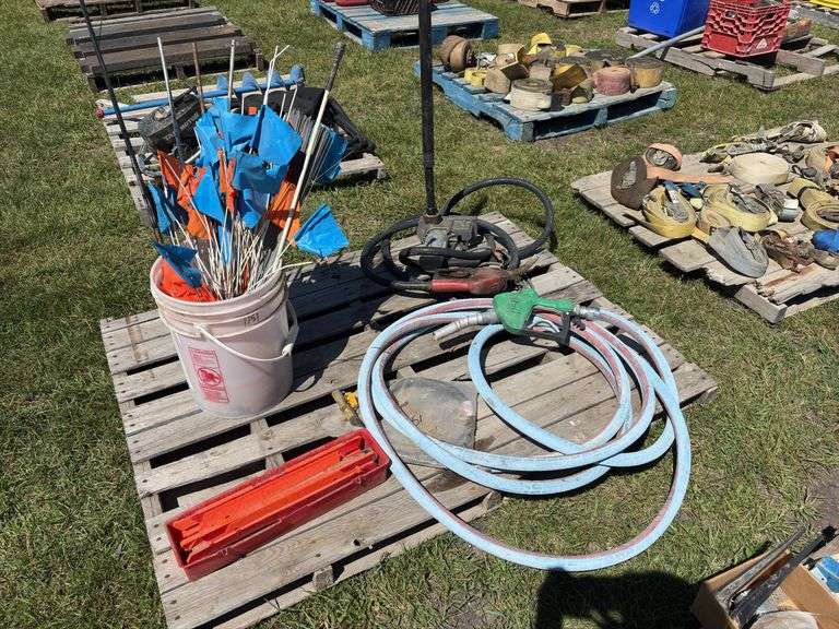 Pallet w/ Fuel pump w/ motor - unknown condition, fuel pump, bucket of market flags, *Unreserved*