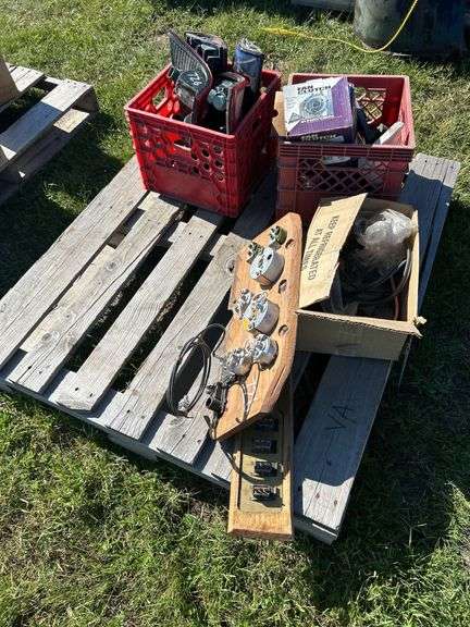 Crate w/ Fan Clutch, Heater Motor, GMC Hord Cover, Door Handle & Misc Plastic Trim, 1 - Crate w/ Taillights 2 - Ford Truck & 2 - Chevy Truck, 80's Datsun Custom Dash w/ Gauges & Switch Panel, 1 - Box w/ Misc. Cords, Saw Blade, & Lens Covers *Unreserved*