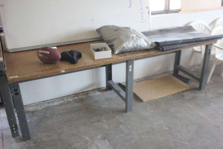 U-LINE HEAVY DUTY WORK BENCH WITH SOLID WOOD TOP AND METAL LEGS WITH HOLES CUT FOR OUTLET INTEGRATION APROX 8' x 30" x 2.5'