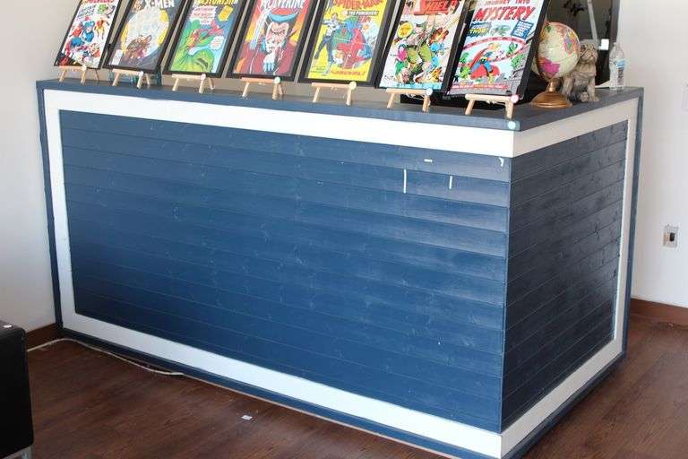 SOLID WOOD L-SHAPED RECEPTIONIST CENTER APROX 8.5'x4.5'x4.5' **nailed together to be one solid piece, can be disassembled with pry tool, bring help & dollies**