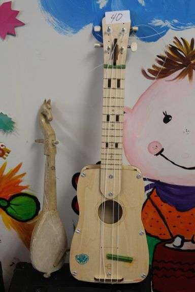 HAND MADE SMALL INSTRUMENTS INCLUDING CUSTOM CARVED WOODEN HORSE THEMED UKULELE AND KIDS GUITAR