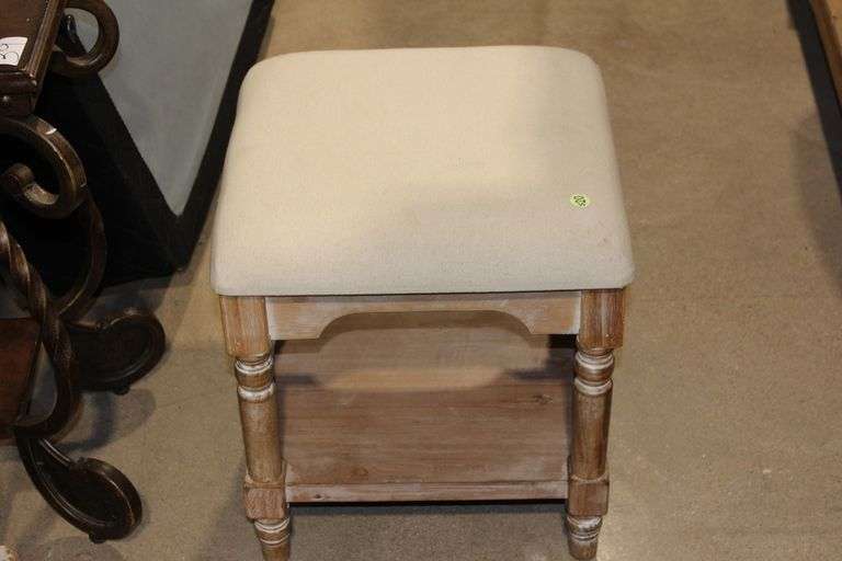 CUSHIONED FOOT STOOL WITH WEATHERED WOOD LEGS AND BOTTOM SHELF