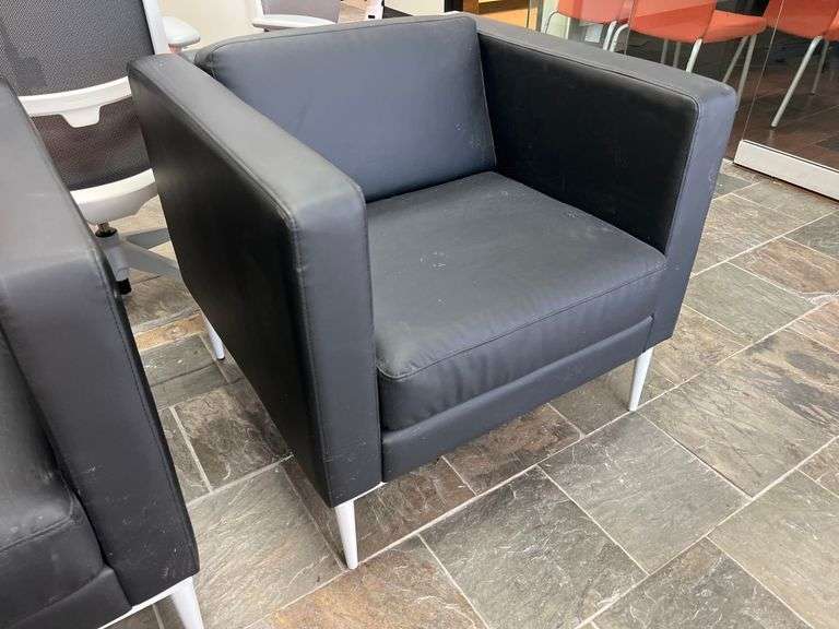 LEATHER-LIKE BLACK LOW LOUNGER APROX 32"SQ x 30"H WITH WHITE METAL LEGS