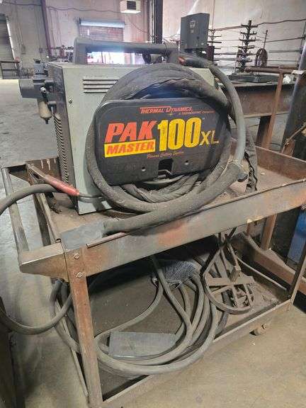 THERMADYNE THERMAL DYNAMICS PAK MASTER 100XL PLASMA CUTTING SYSTEM WITH PCH-80 TORCH & EXTREMELY LONG POWER CABLE ; ON SOLID METAL ROLLING CART APROX 40"x24"x33"