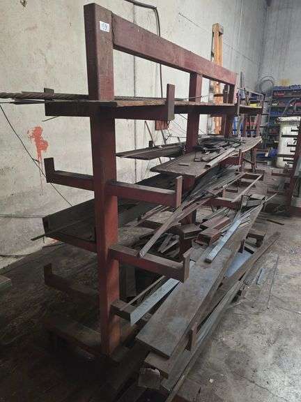 SOLID METAL MATERIAL ROLLING STAND APROX 6.5' x 39" x 5.5' WITH NUMEROUS METAL STOCK PCS INCLD.