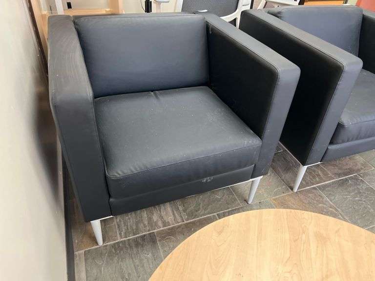 LEATHER-LIKE BLACK LOW LOUNGER APROX 32"SQ x 30"H WITH WHITE METAL LEGS