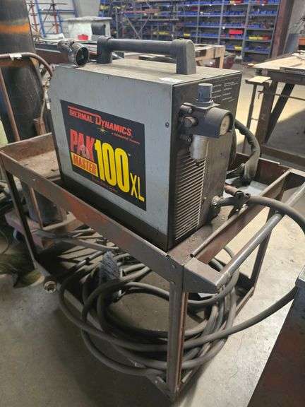 THERMADYNE THERMAL DYNAMICS PAK MASTER 100XL PLASMA CUTTING SYSTEM WITH PCH-80 TORCH & EXTREMELY LONG POWER CABLE ; ON SOLID METAL ROLLING CART APROX 40"x24"x33"