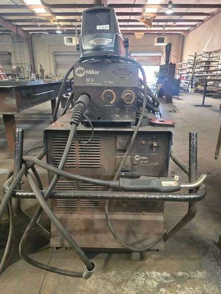 MILLER CP-302 CV DC WELDING POWER SOURCE COMPLETE WITH 22 A 24V WIRE FEEDER, YES WELDER TORCH, CARBON DIOXIDE TANK CABLES ECT