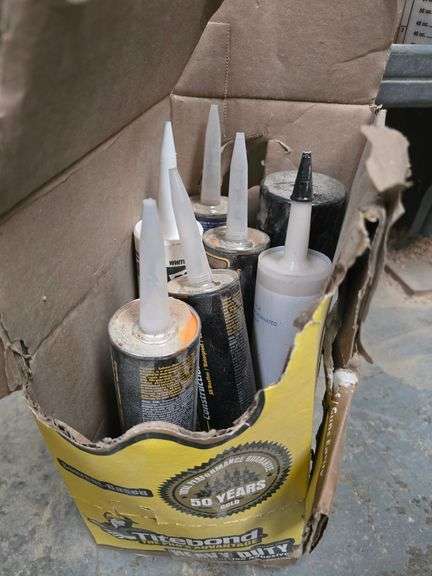 TUBES OF CAULKING AND ADHESIVES