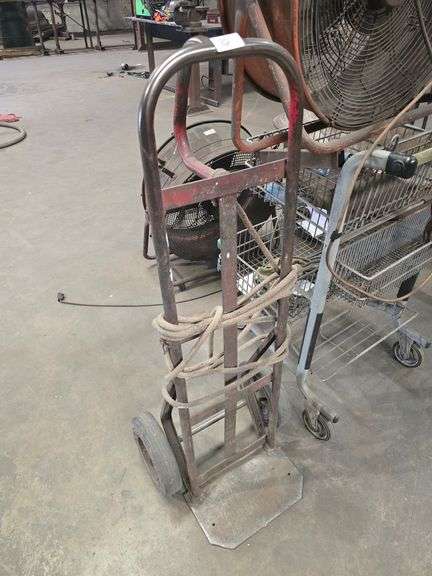 SOLID METAL DOLLY APROX 4'H