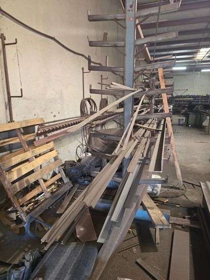 SOLID IRON STOCK PCS INCLUDING PRE TWISTED PIECES.. LONGEST PIECE IN LOT APROX 20'3" WITH ABOUT 30PCS TOTAL IN LOT WITH SOLID METAL MATERIAL STAND 9-TIER APROX 14'4" x 37" x 8'2" INCLUDED