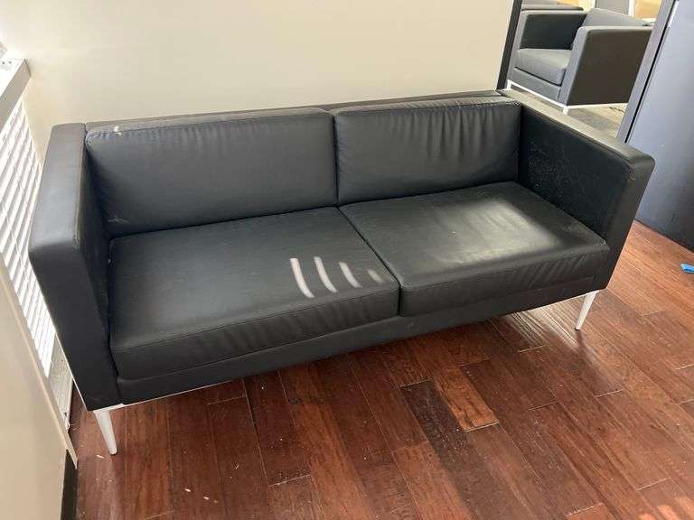 LEATHER-LIKE BLACK LOW COUCH APROX 6' x 32"x 30" WITH WHITE METAL LEGS