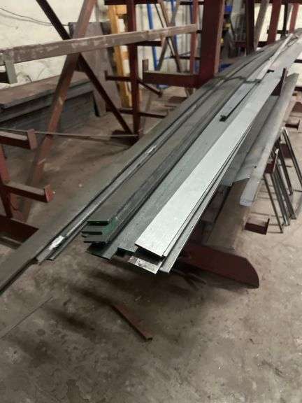 SOLID IRON STOCK PCS.. LONGEST PIECE IN LOT APROX 12' WITH ABOUT 30PCS TOTAL IN LOT WITH SOLID METAL MATERIAL STAND 9-TIER APROX 106" x 16.5" x 67" INCLUDED **sold per stand