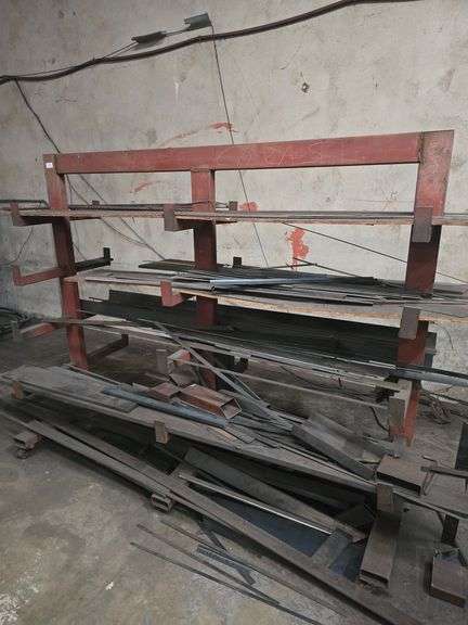 SOLID METAL MATERIAL ROLLING STAND APROX 6.5' x 39" x 5.5' WITH NUMEROUS METAL STOCK PCS INCLD.