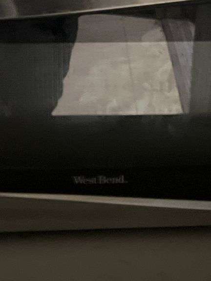 WEST BEND 900W STAINLESS STEEL AND BLACK MICROWAVE FOR REPAIR