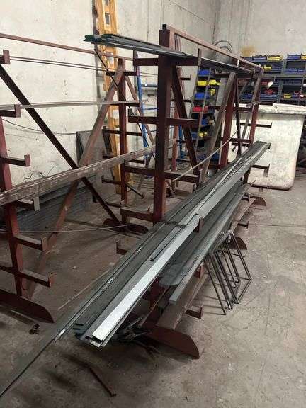 SOLID IRON STOCK PCS.. LONGEST PIECE IN LOT APROX 12' WITH ABOUT 30PCS TOTAL IN LOT WITH SOLID METAL MATERIAL STAND 9-TIER APROX 106" x 16.5" x 67" INCLUDED **sold per stand